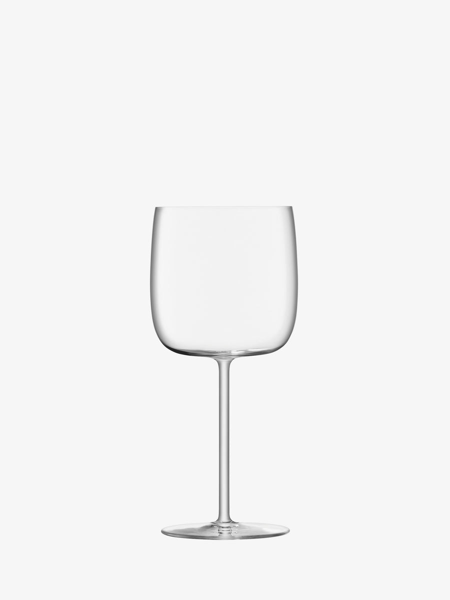 A clear, empty lsa-international Wine Glass with a thin, tall stem and round bowl is centered on a plain white background, showcasing the elegance of lead-free crystalline glass.