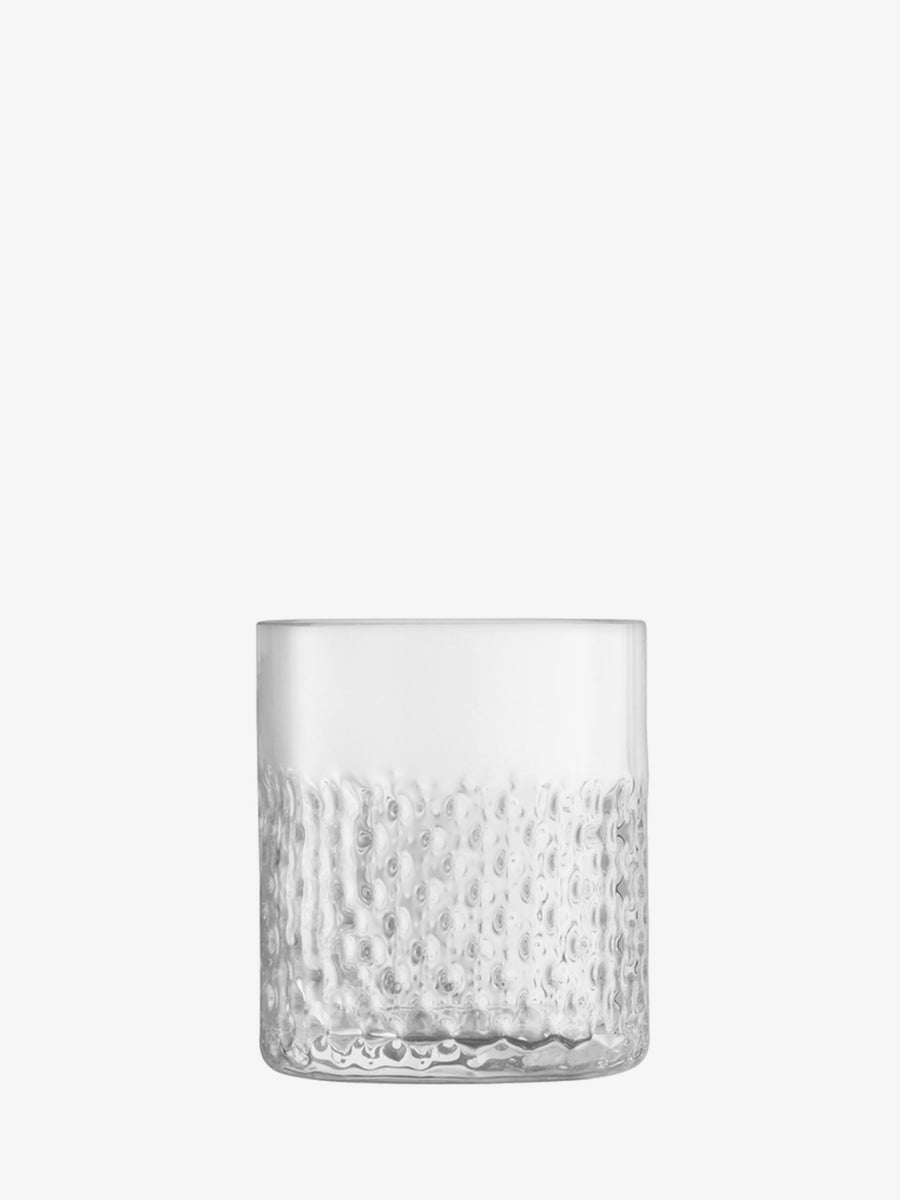The lsa-international Tumbler features a clear, short glass form with a smooth upper half and a textured, dimpled lower half inspired by wicker design, displayed against a plain white background.