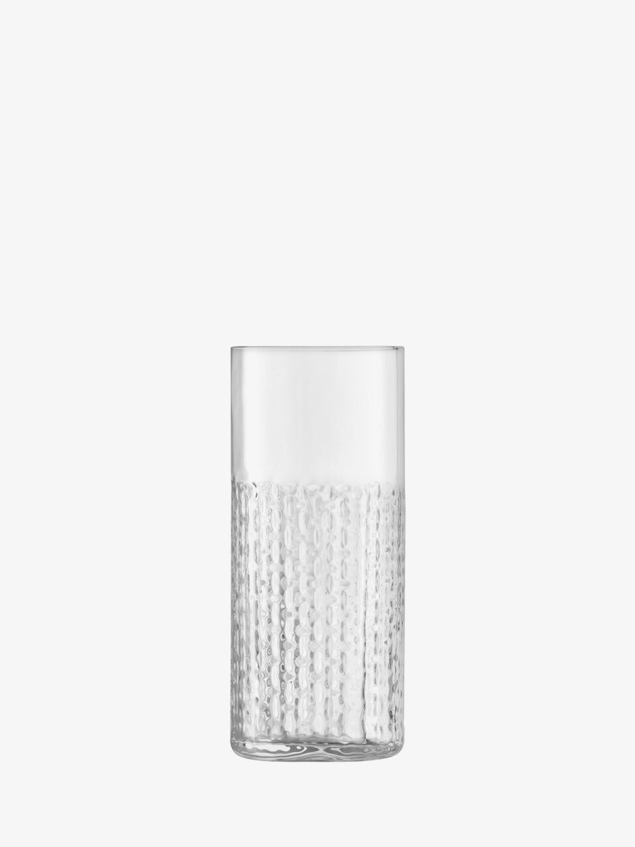 A lsa-international Highball glass, featuring a clear, textured dotted pattern on the lower half that echoes wicker-inspired designs, stands upright against a plain white background.