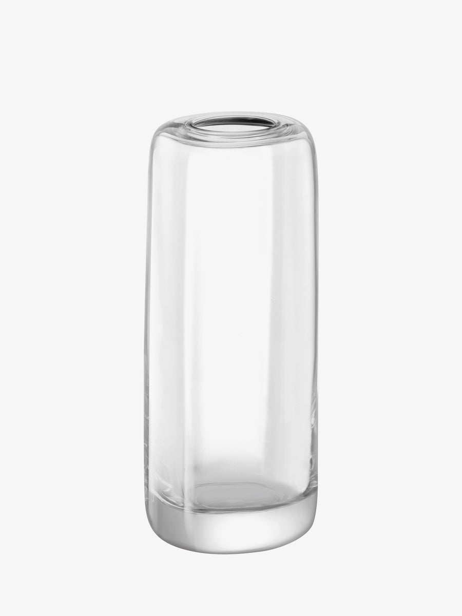 The lsa-international Vase is a clear, empty cylindrical glass vessel featuring a substantial thick base. Expertly mouth-blown, the vase’s flawless form reflects exceptional craftsmanship. Standing tall against a plain white background, this contemporary piece by lsa-international exudes elegant simplicity.