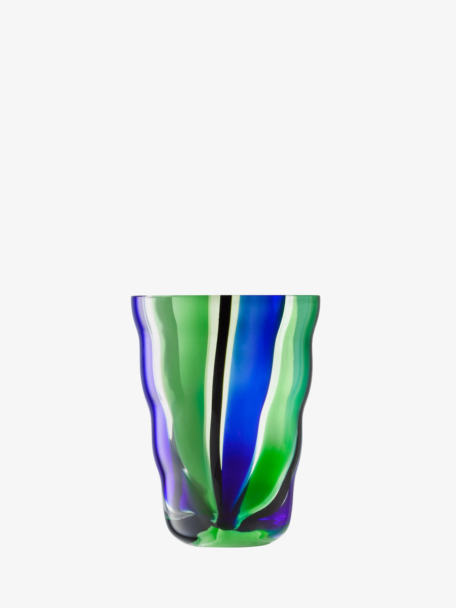 The lsa-international Tumbler features a mouth-blown, slightly rippled surface with a rounded shape and folk-inspired vertical wavy stripes in green, blue, and black on white.