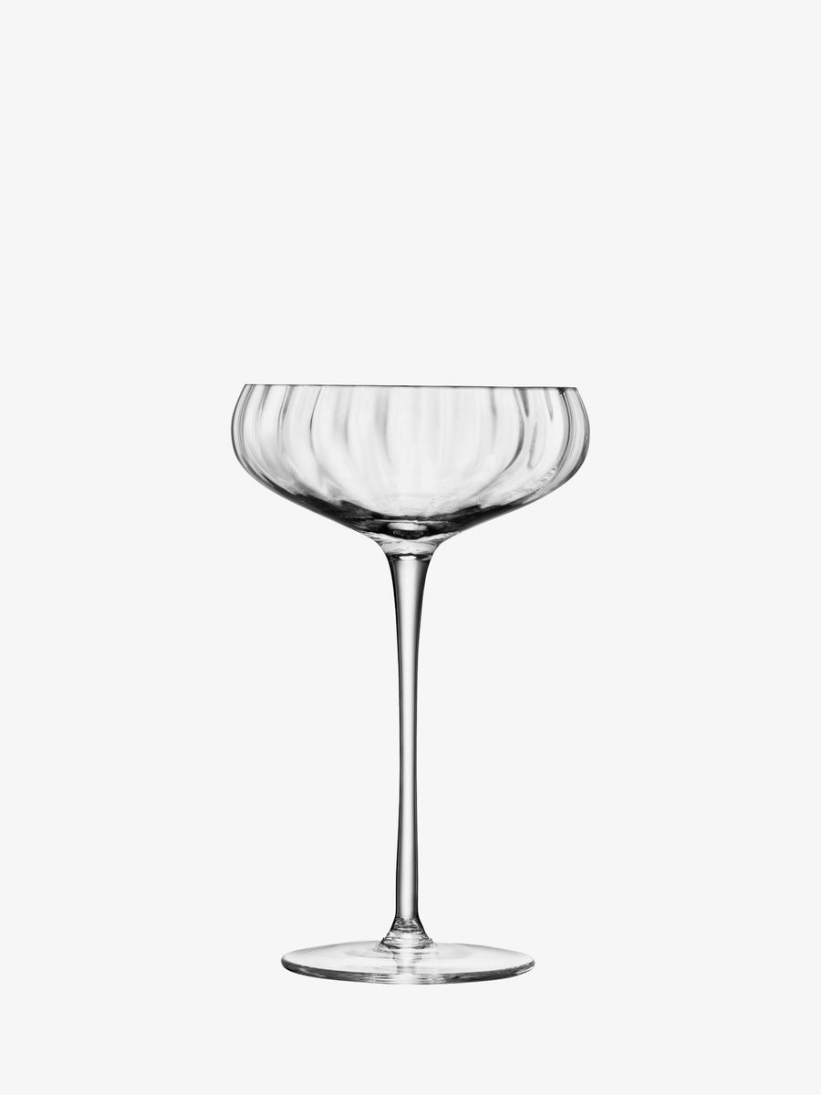 A clear Champagne Saucer by lsa-international, featuring a short, wide bowl and a long stem, is centered on a plain white background—highlighting the classic elegance that defines this iconic cocktail glass.