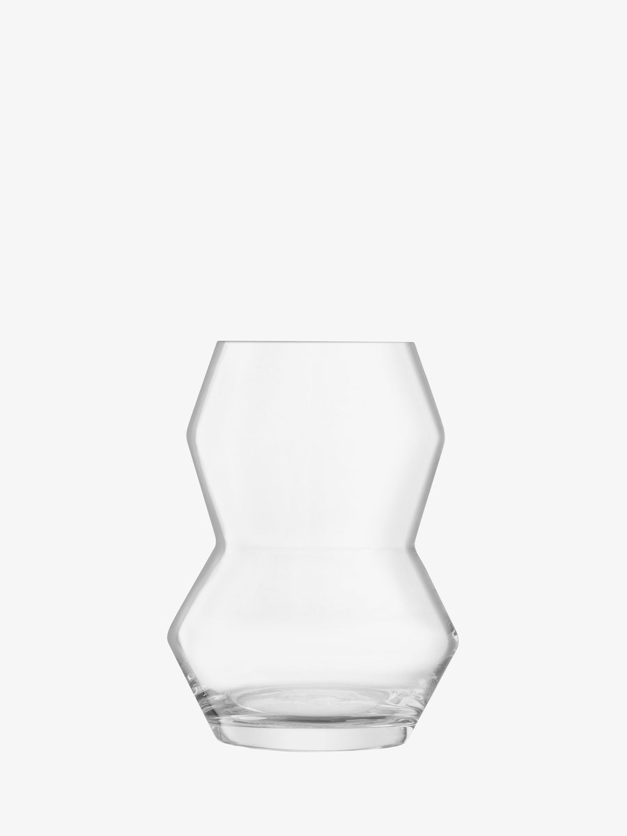 The lsa-international Vase is crafted from clear glass with a geometric, angular design, showcasing indented sides and a wide base; this modern mouth-blown vase is presented against a plain white background.