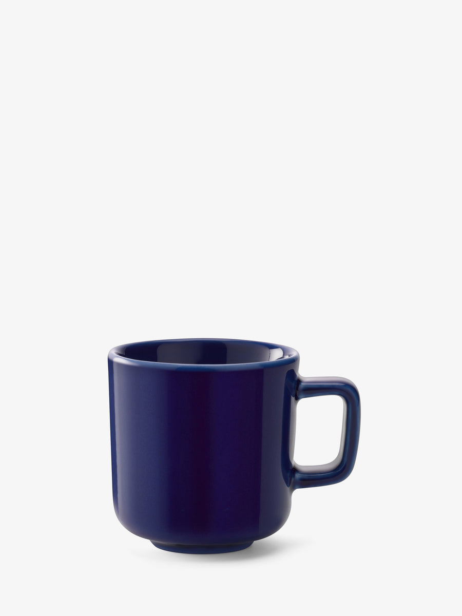 The lsa-international Espresso Cup features a plain, dark blue ceramic finish and a rectangular handle, displayed on a white background. This dishwasher safe cup blends contemporary design with everyday practicality, making it a stylish addition to any tableware collection.
