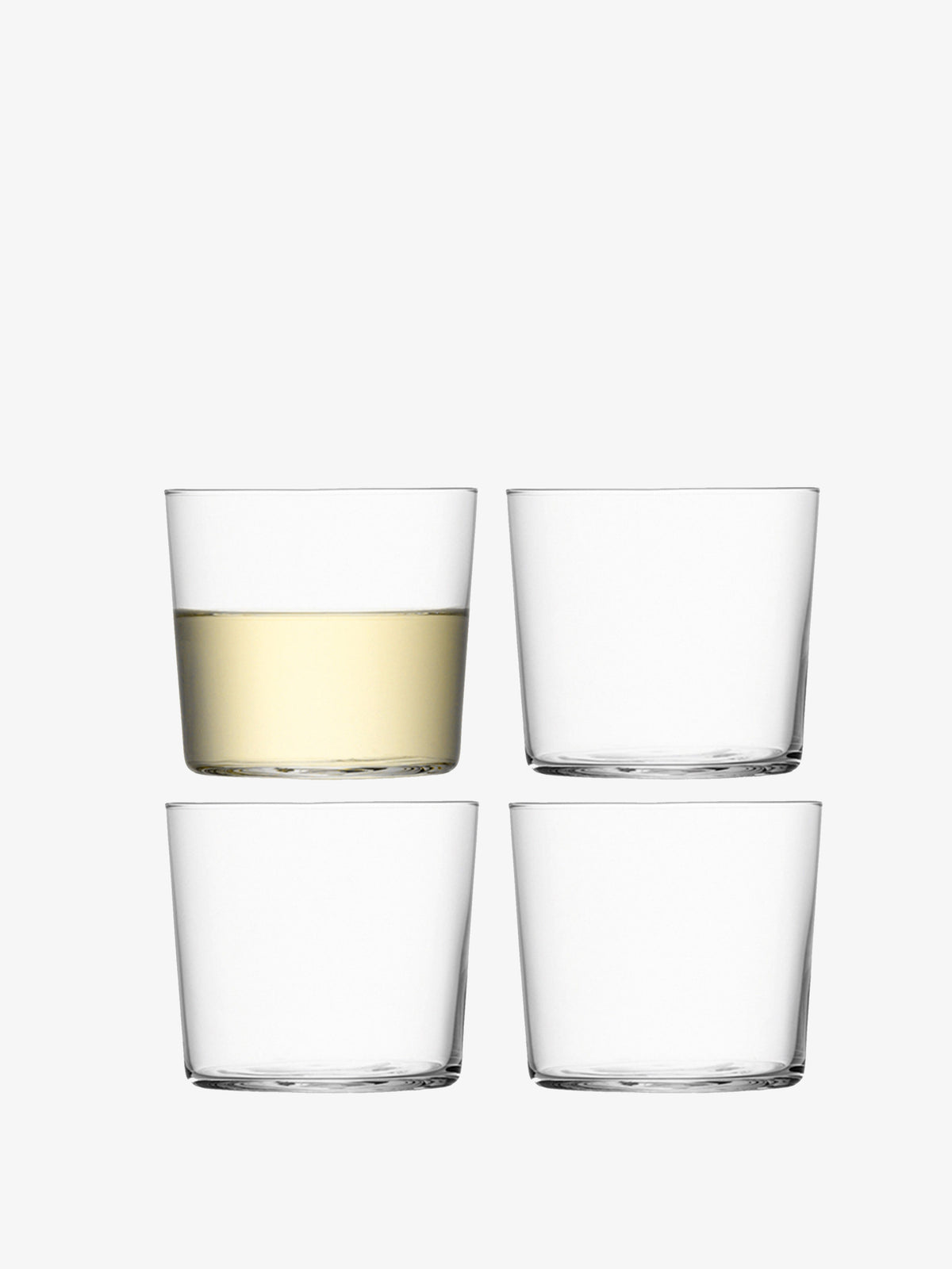 A set of 4 Gio Tumbler from LSA International with one containing wine filled to the half while the other 3 tumblers are empty in front of a grey white background.