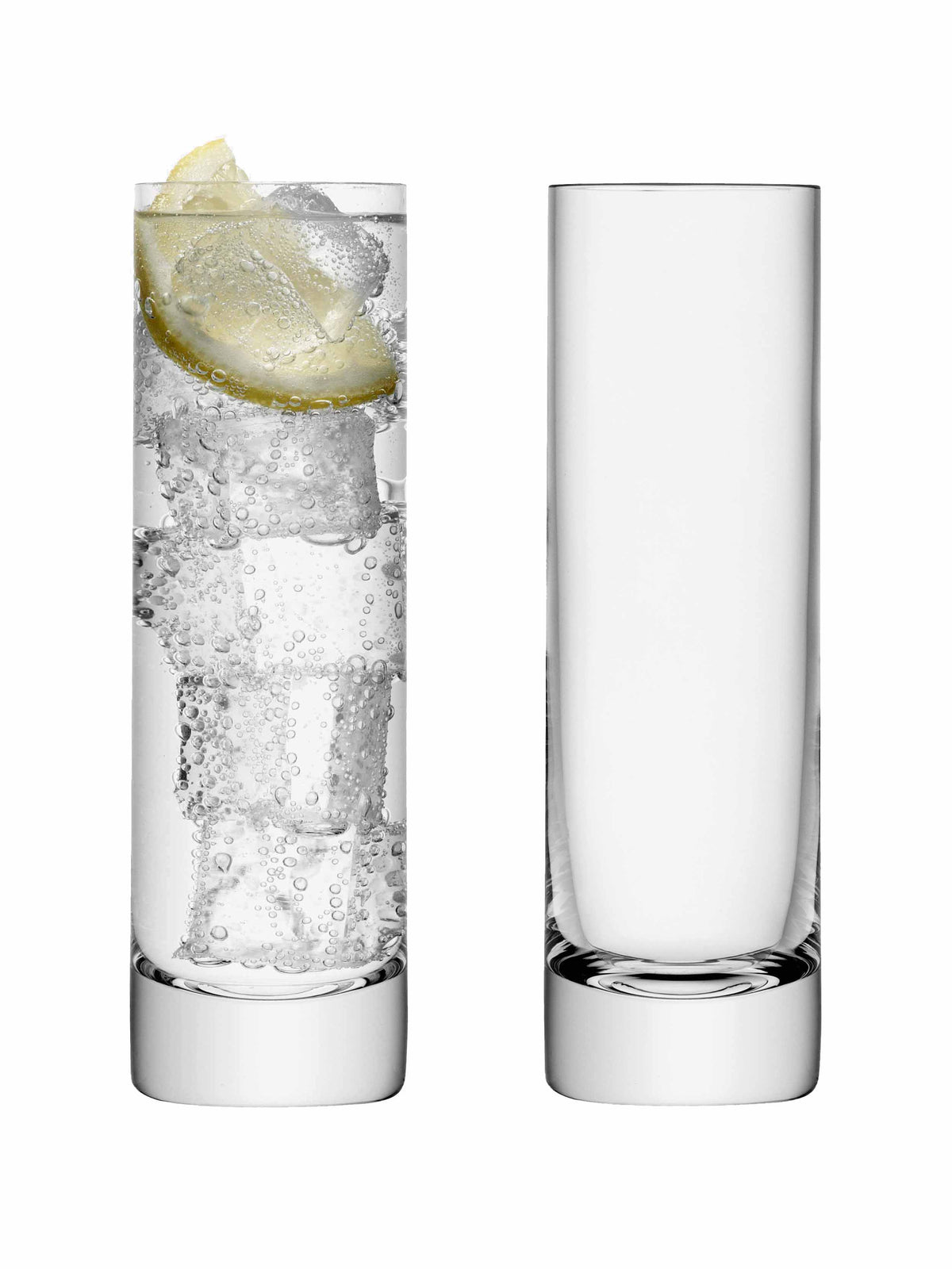 Two tall, clear Long Drink Glasses by lsa-international stand side by side; the left glass is filled with sparkling water, ice cubes, and a lemon slice, while the right glass remains empty. These elegant vessels are mouth-blown slim highballs, perfect for serving sophisticated refreshments.