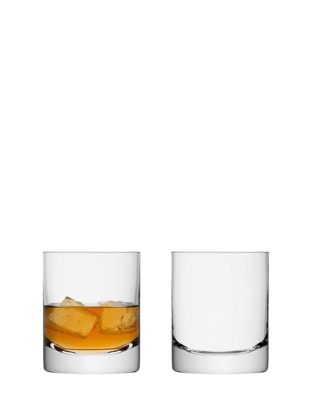 Two lsa-international Tumbler glasses are displayed on a white background; the left glass is filled with amber liquid and ice cubes, while the right glass remains empty. These sleek cylindrical tumblers from lsa-international are ideal for stylishly serving your favorite drinks.