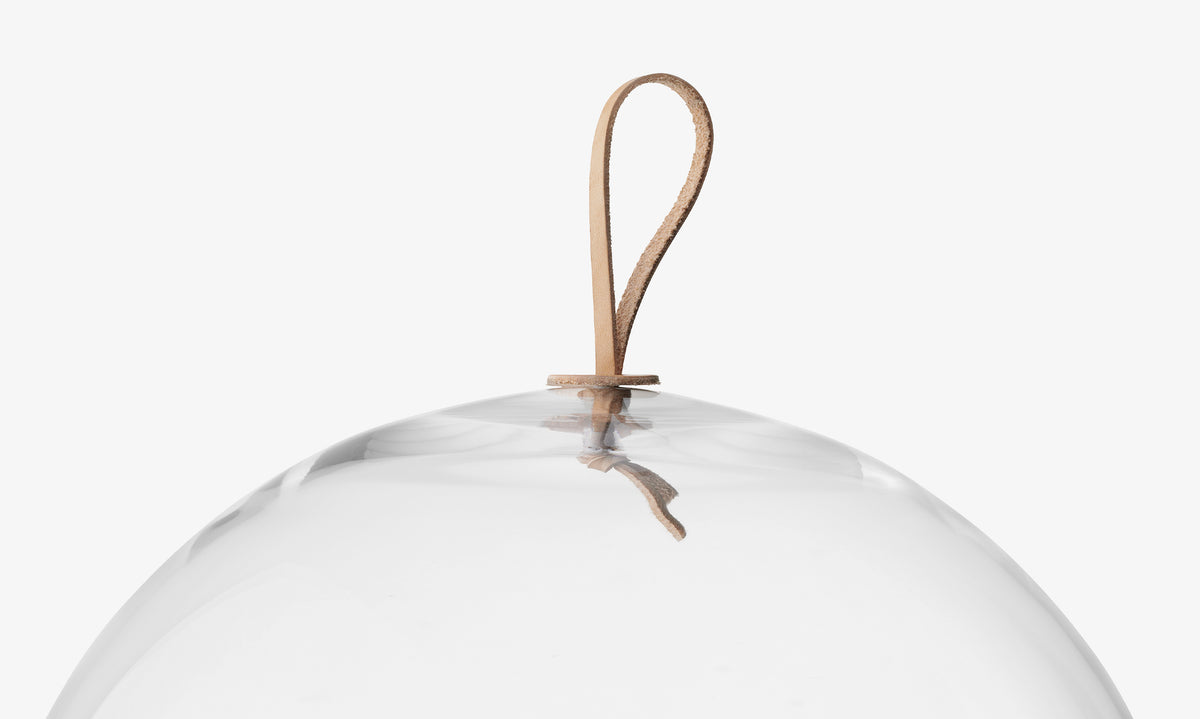 LSA International Dome & Ash Base, a clear glass dome cake stand with a small leather loop handle at the top.