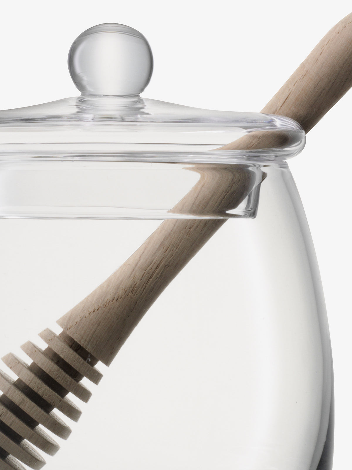 The lsa-international Honey Pot & Dipper features a mouth-blown glass pot with a clear lid and an oak dipper, presented against a white background.