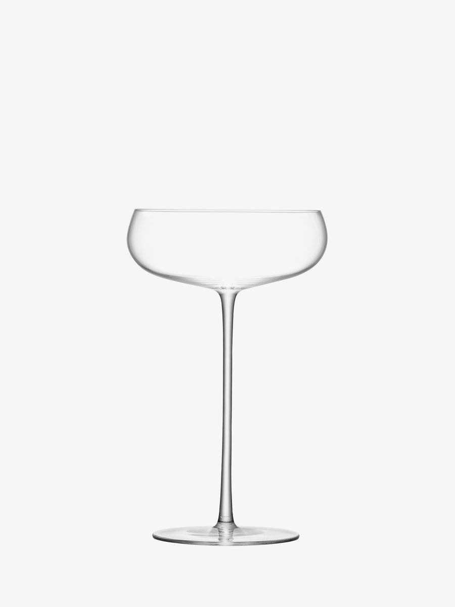 A clear, empty Champagne Saucer by lsa-international, featuring a wide, shallow bowl and a long, slender stem, is photographed against a plain white background—this elegant piece embodies the timeless appeal of coupe glasses, making it a sophisticated choice for stylish gatherings.