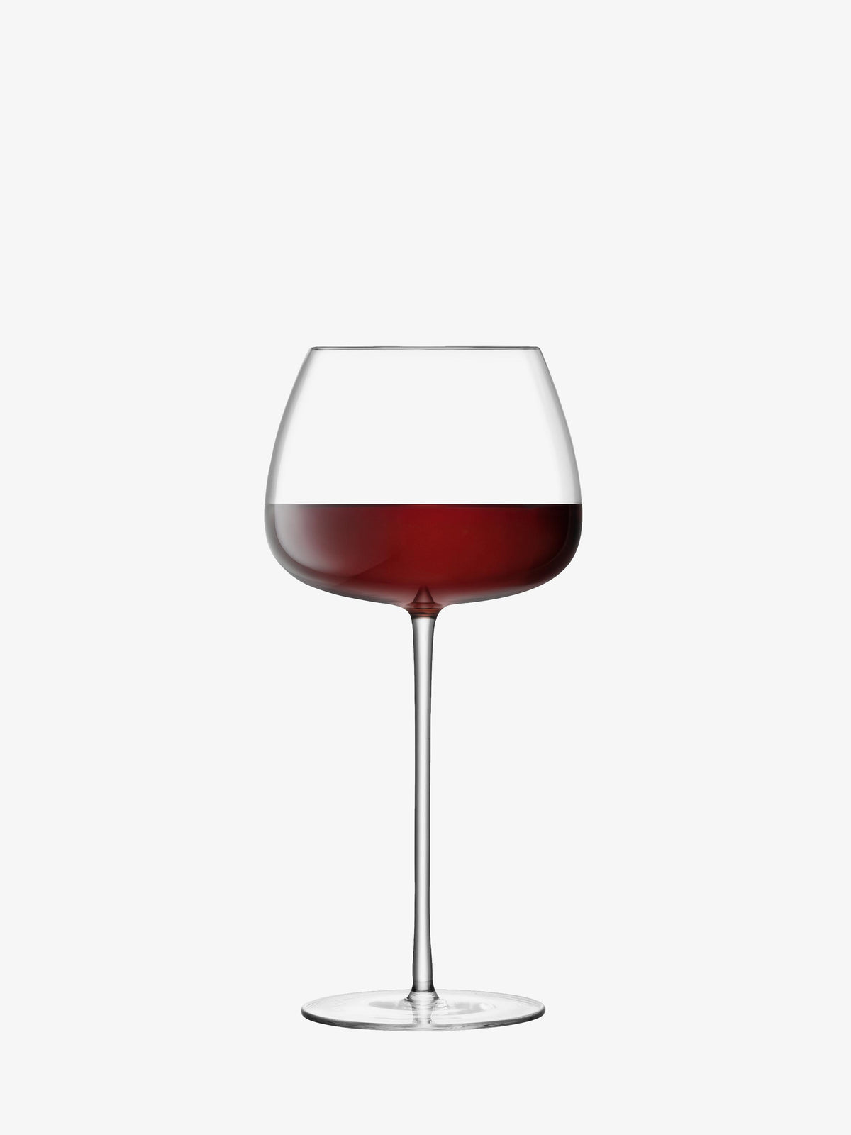 A lsa-international Red Wine Balloon Glass, hand crafted in a large, modern design and filled halfway with red wine, is showcased against a plain white background.