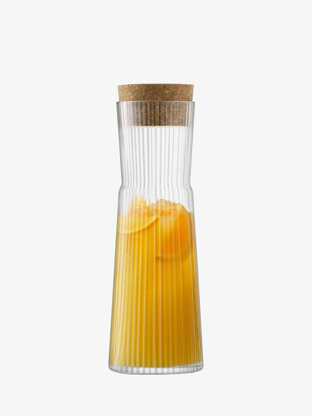 A lsa-international Carafe & Cork Stopper with a fluted clear glass design, filled with yellow-orange juice and orange slices, is set against a plain white background.