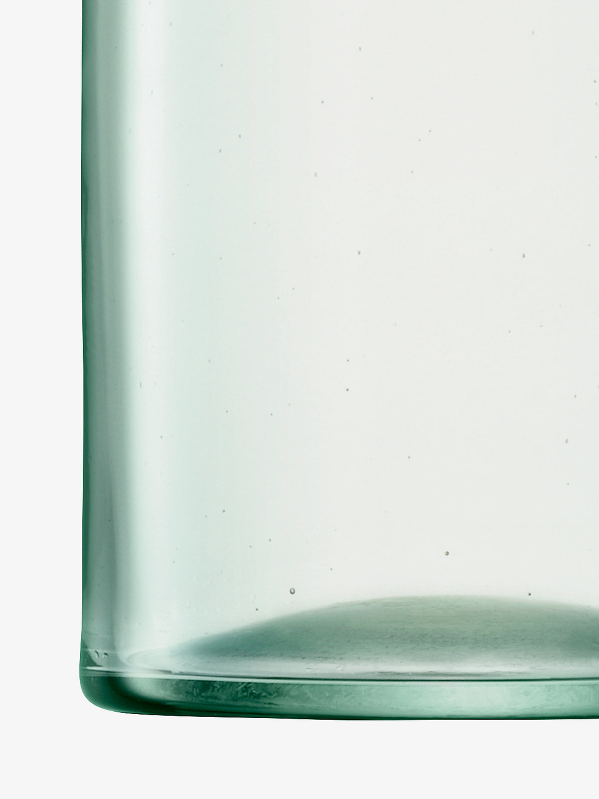 Close-up of the bottom portion of a clear, empty cylindrical Tumbler by lsa-international, made from recycled glass and featuring a smooth surface with an eco-friendly design.