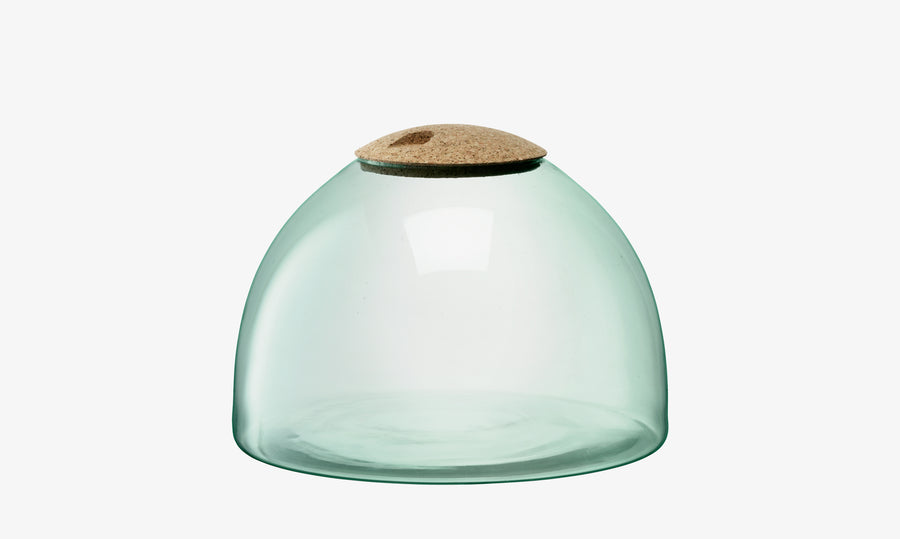 The lsa-international Closed Garden is a transparent, dome-shaped recycled glass planter featuring a wide base and finished with a round cork lid on top, displayed against a plain white background.