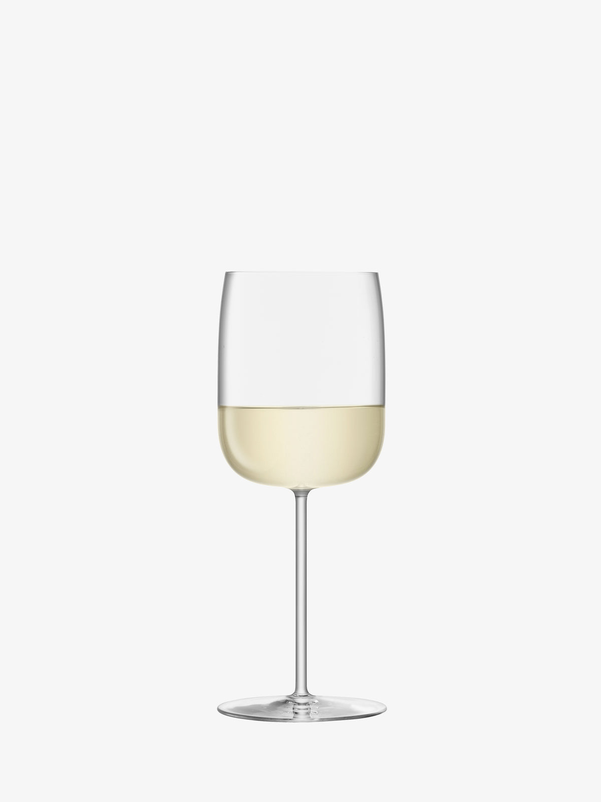An lsa-international Wine Glass, featuring a clear crystalline design and a tall stem, is filled halfway with white wine and stands upright against a plain white background.