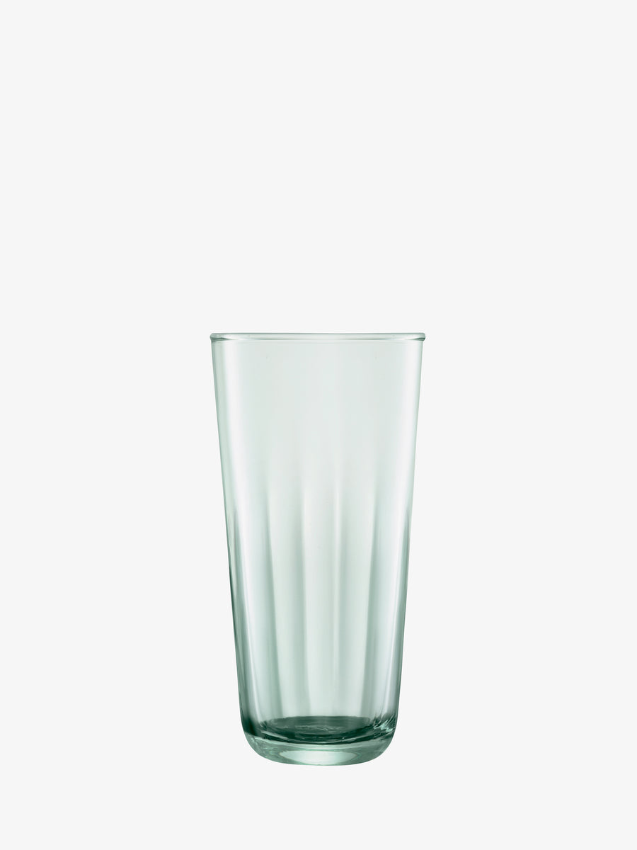 A transparent, empty Tall Highball glass by lsa-international with vertical grooves sits centered on a plain white background, showcasing the elegant design of fluted drinking glasses.