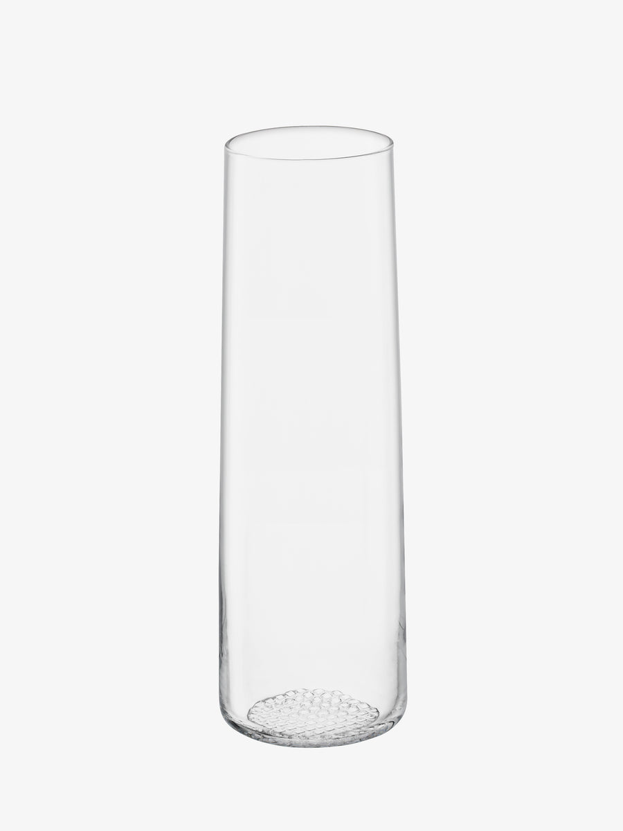The lsa-international Vase is a tall piece crafted from clear glass, showcasing a slightly tapered cylindrical form with an elegantly textured base, displayed against a white background.