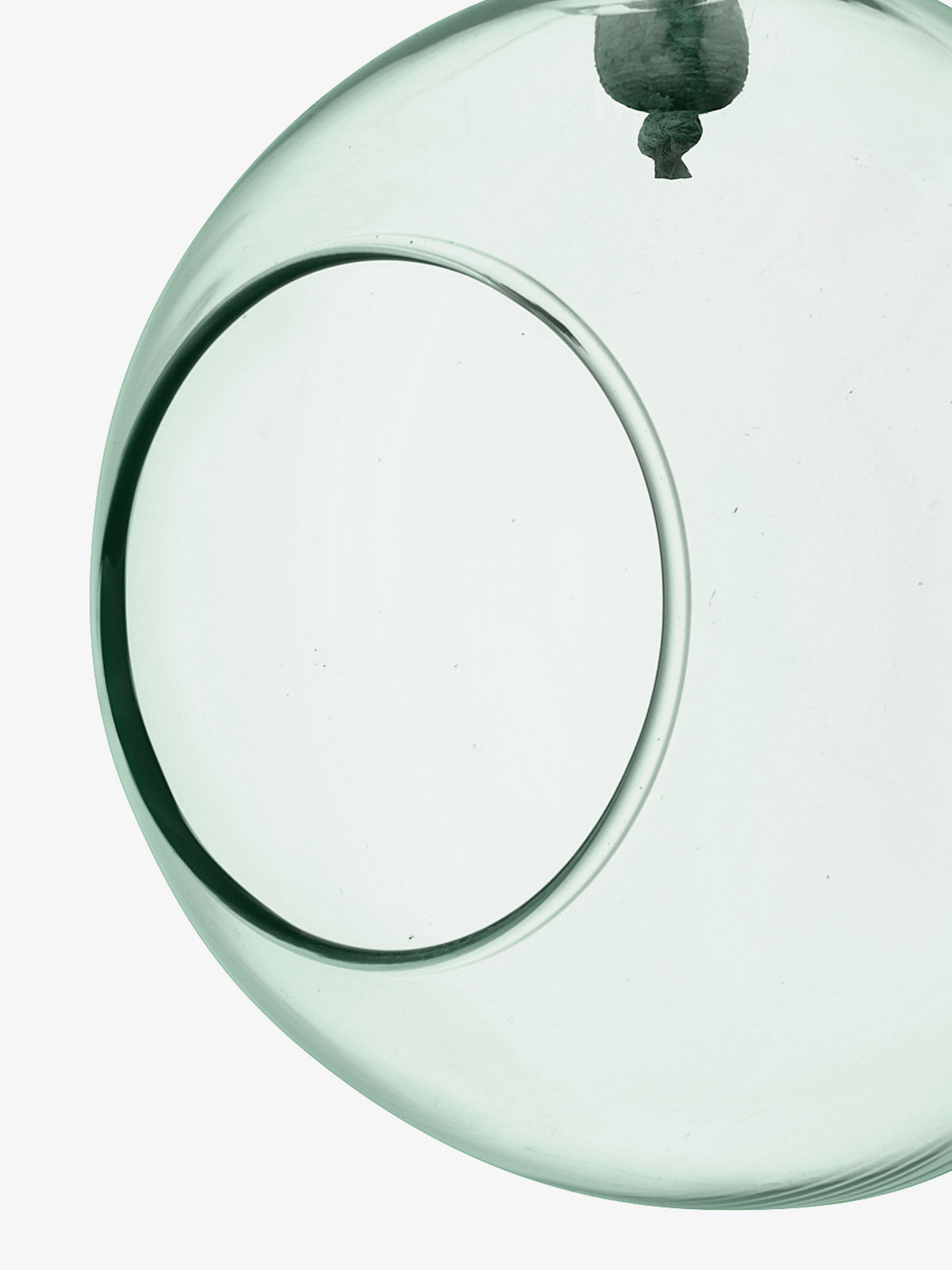 A close-up of the Hanging Planter by lsa-international, a transparent round glass piece crafted from recycled glass, featuring a circular opening and smooth edges, set against a white background.