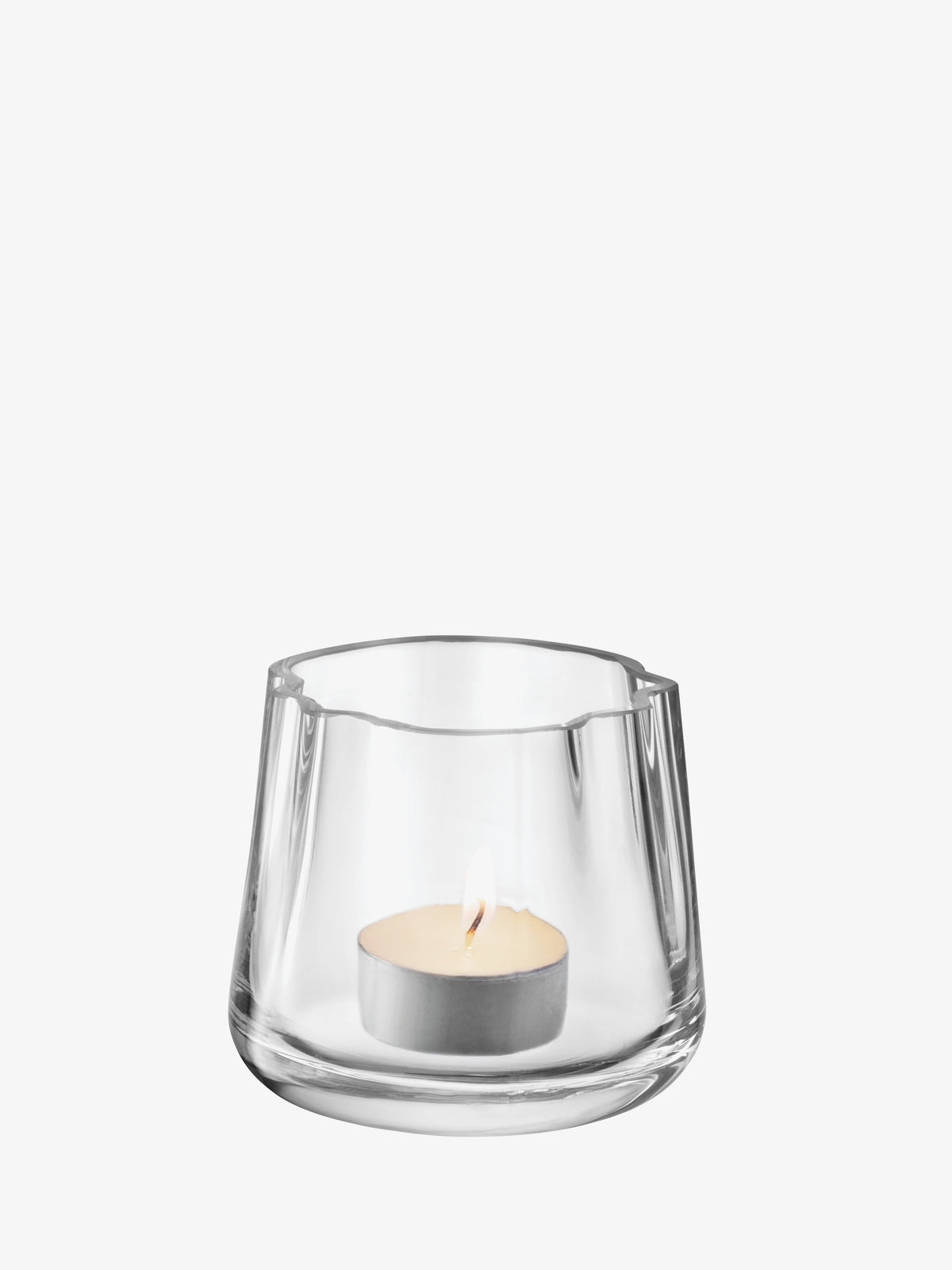 Clear glass Tealight Holder/Vase with a wavy rim containing a lit candle.
