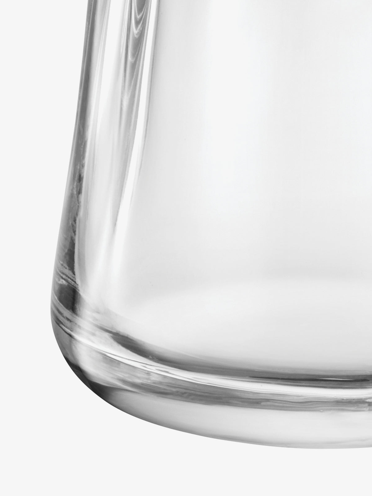 Close-up of the curved base of a clear glass Tealight Holder/Vase.