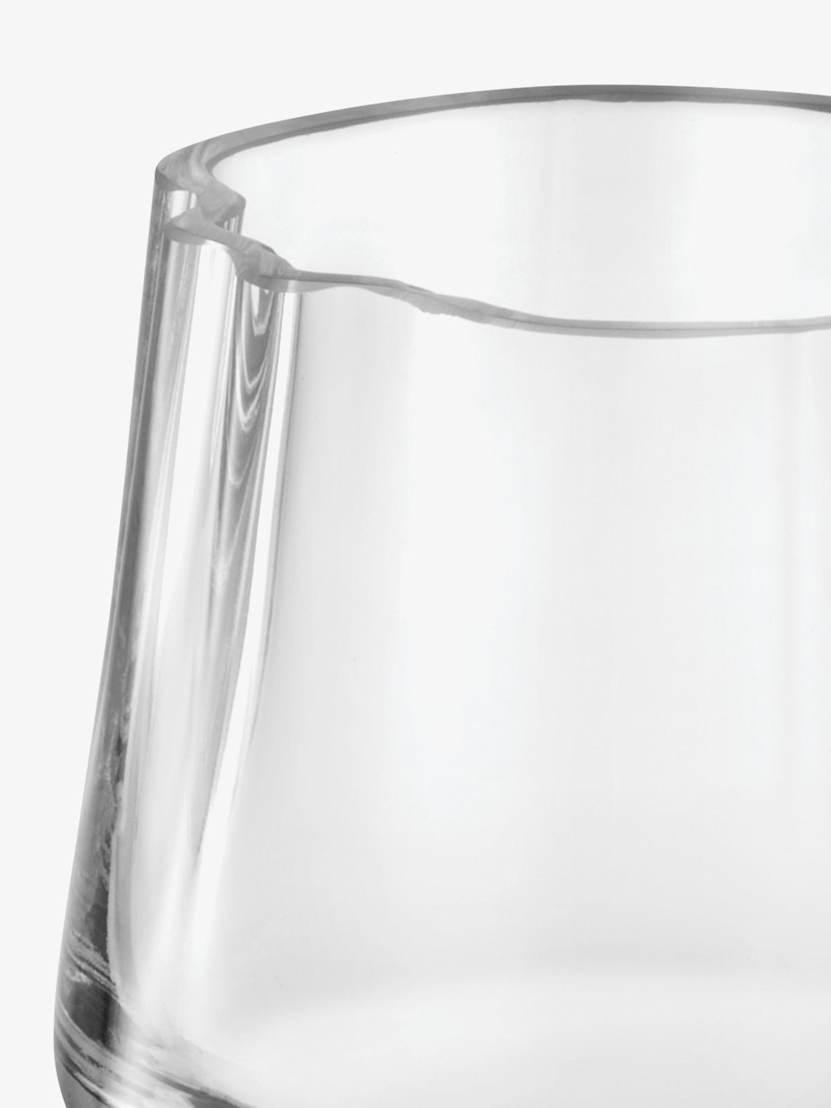 Close-up of a clear glass Tealight Holder/Vase with a wavy, irregular rim.
