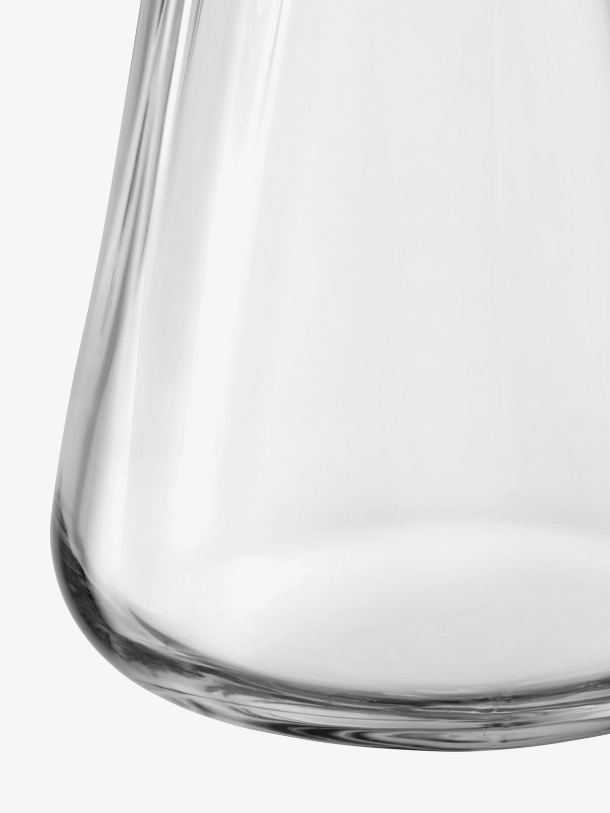 Close-up of the organic, curved base of a clear, mouth-blown glass LSA International Vase/Lantern.