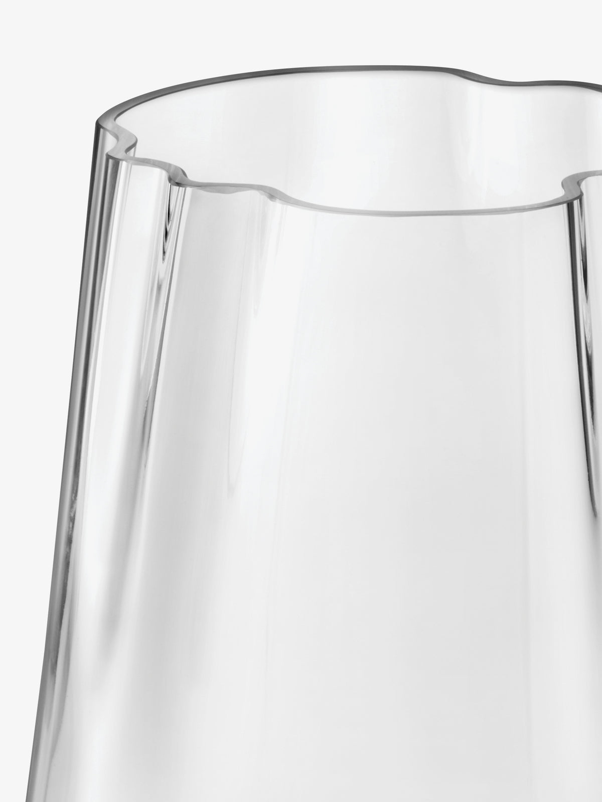 Close-up of an LSA-International Vase/Lantern, a mouth-blown glass vessel with an organic, wavy, scalloped rim.