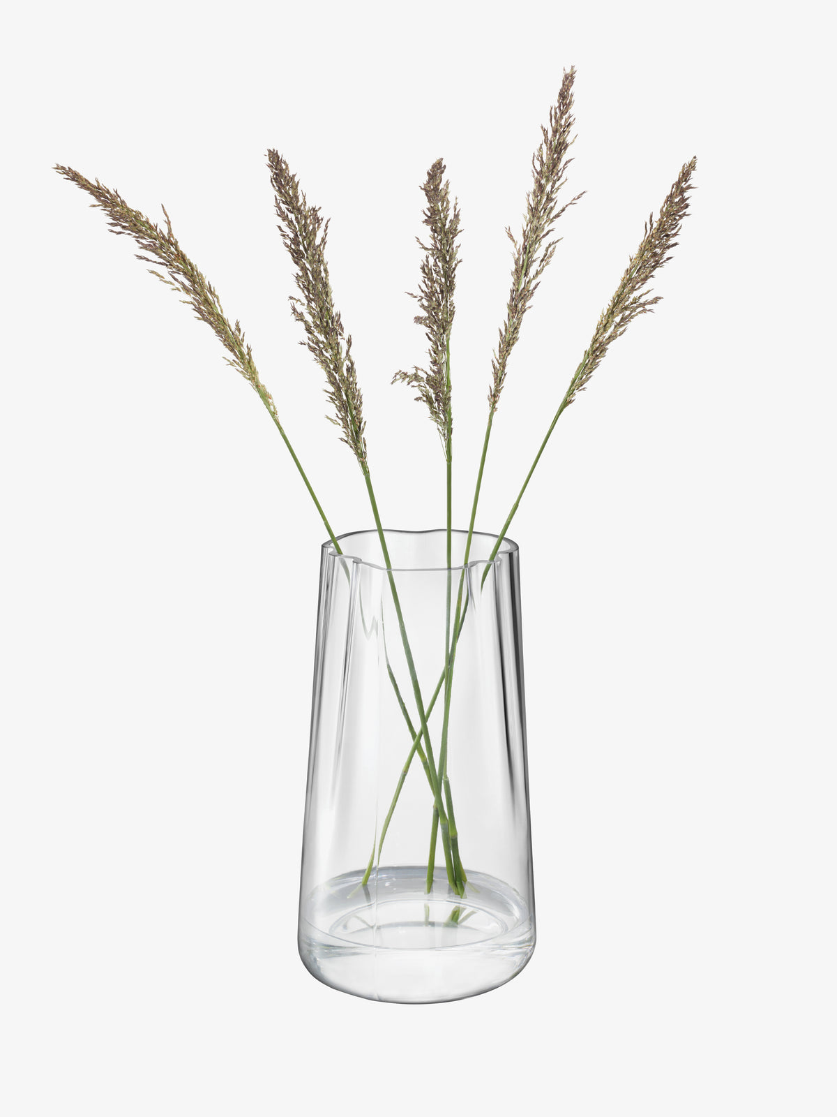 Four stalks of tall grass in an organic-shaped, mouth-blown glass Vase/Lantern by lsa-international.