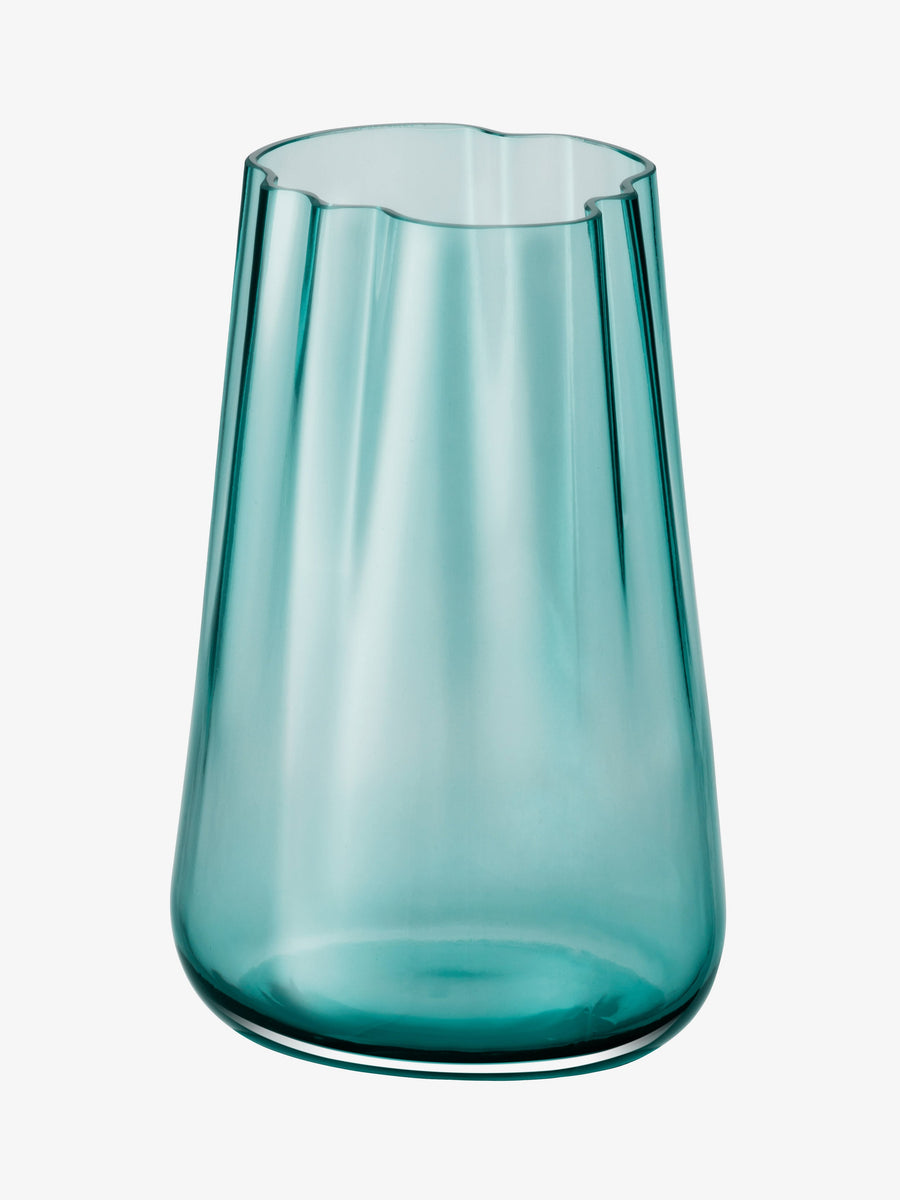 A translucent blue-green mouth-blown Vase/Lantern by lsa-international, featuring an organic form with a smooth, slightly tapered shape and an irregular, wavy rim, set against a plain white background.