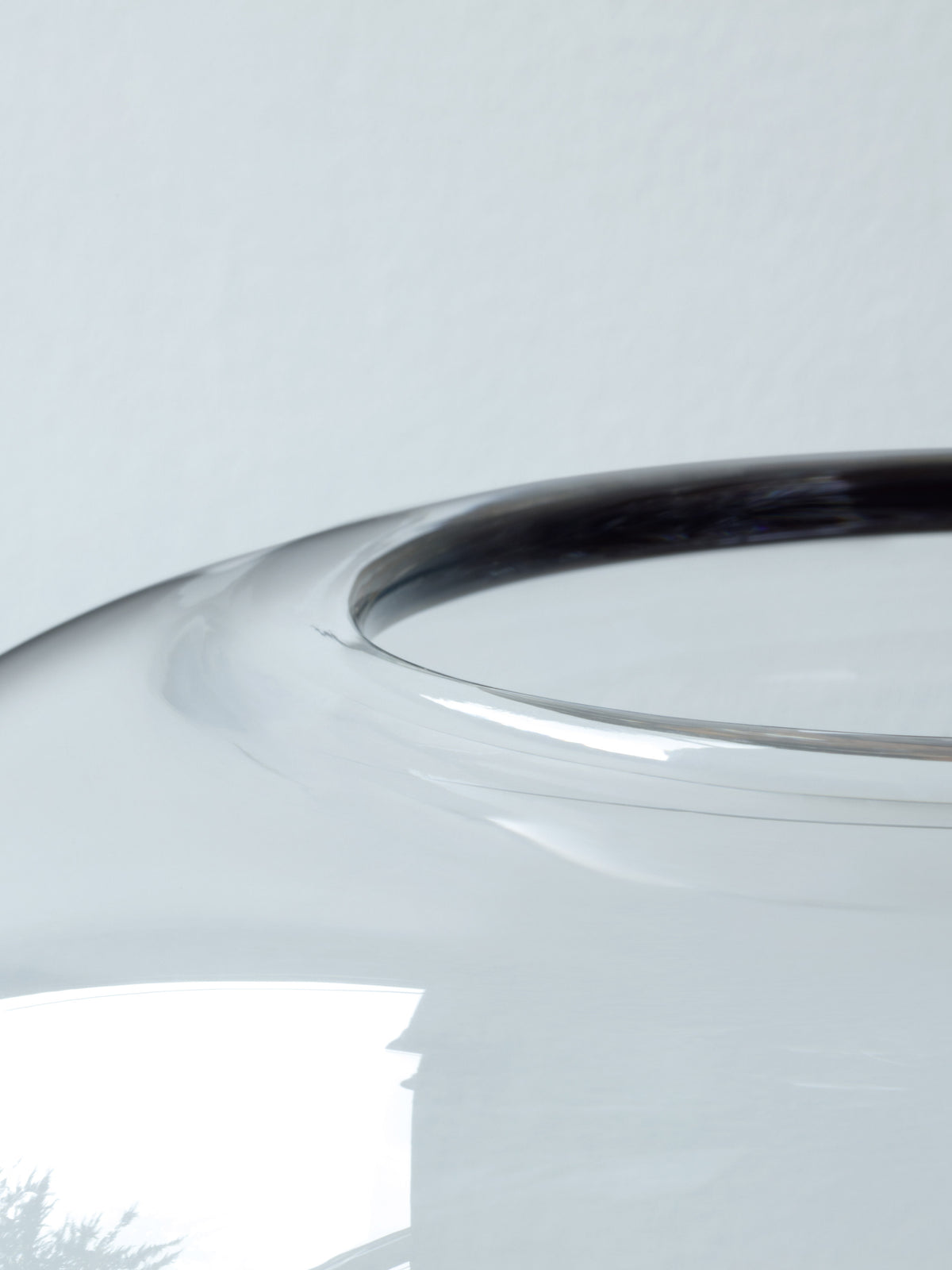 Close-up view of the rounded rim of a mouth-blown LSA International vase.