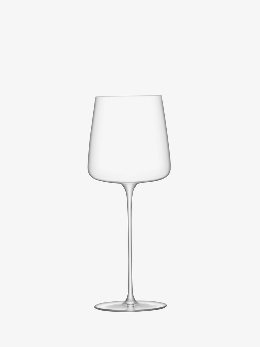 A clear, empty Grand Cru Glass by lsa-international, featuring a long stem and wide bowl, is centered on a plain white background and elegantly crafted from crystalline glass.