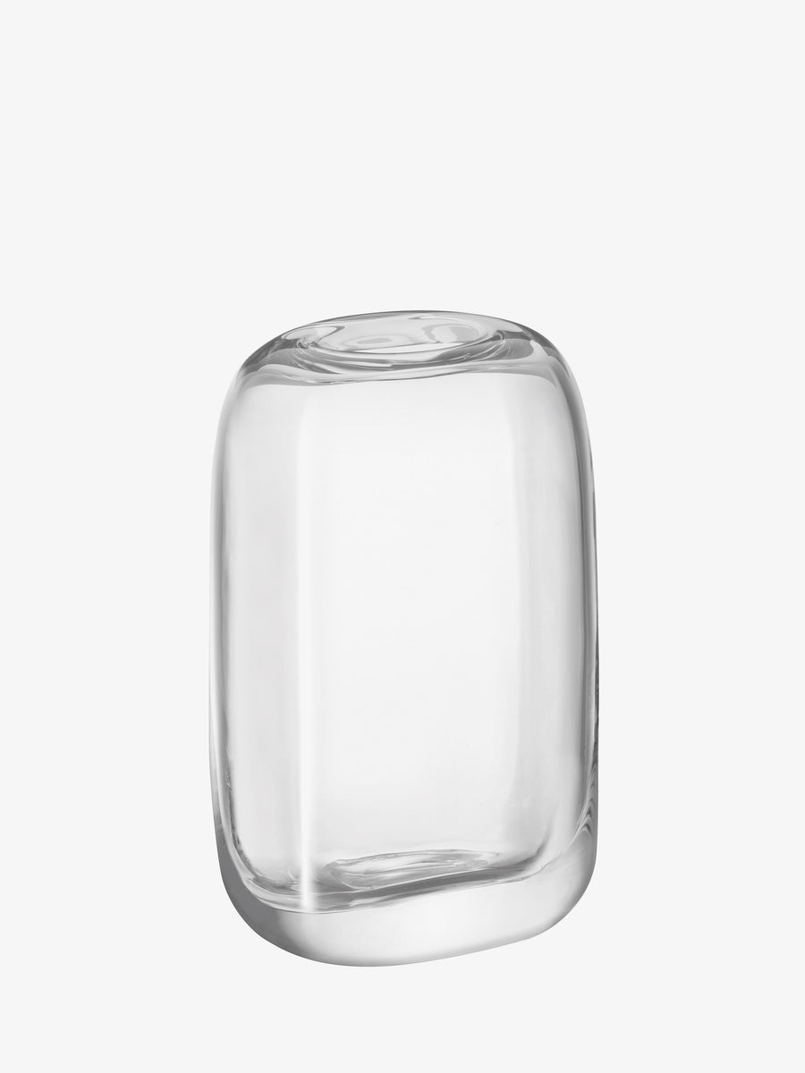 The lsa-international Vase features a clear, rounded form with smooth edges and a gently organic, slightly uneven silhouette. Expertly crafted from mouth-blown glass, this contemporary vase is displayed against a plain white background.