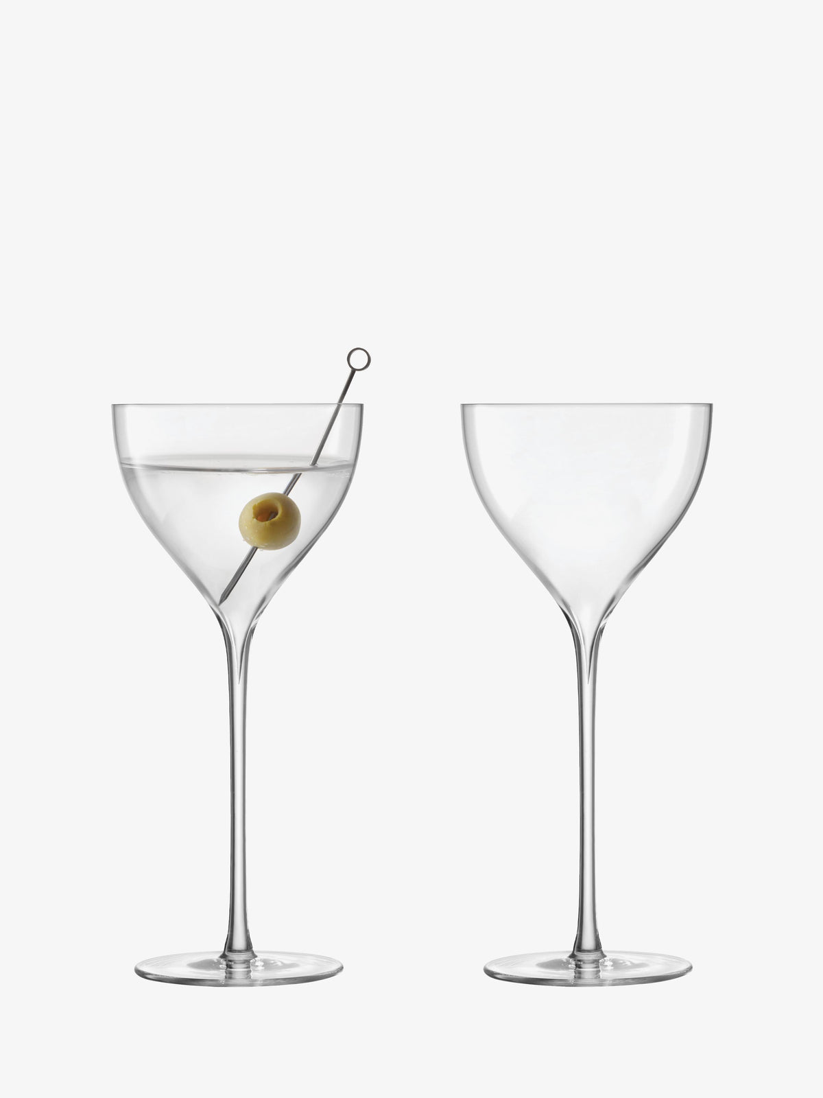 Two elegant lsa-international Nick & Nora glasses are displayed on a white background; one is empty, and the other contains a clear cocktail garnished with a green olive on a pick, beautifully highlighting the timeless charm of these classic cocktail glasses.