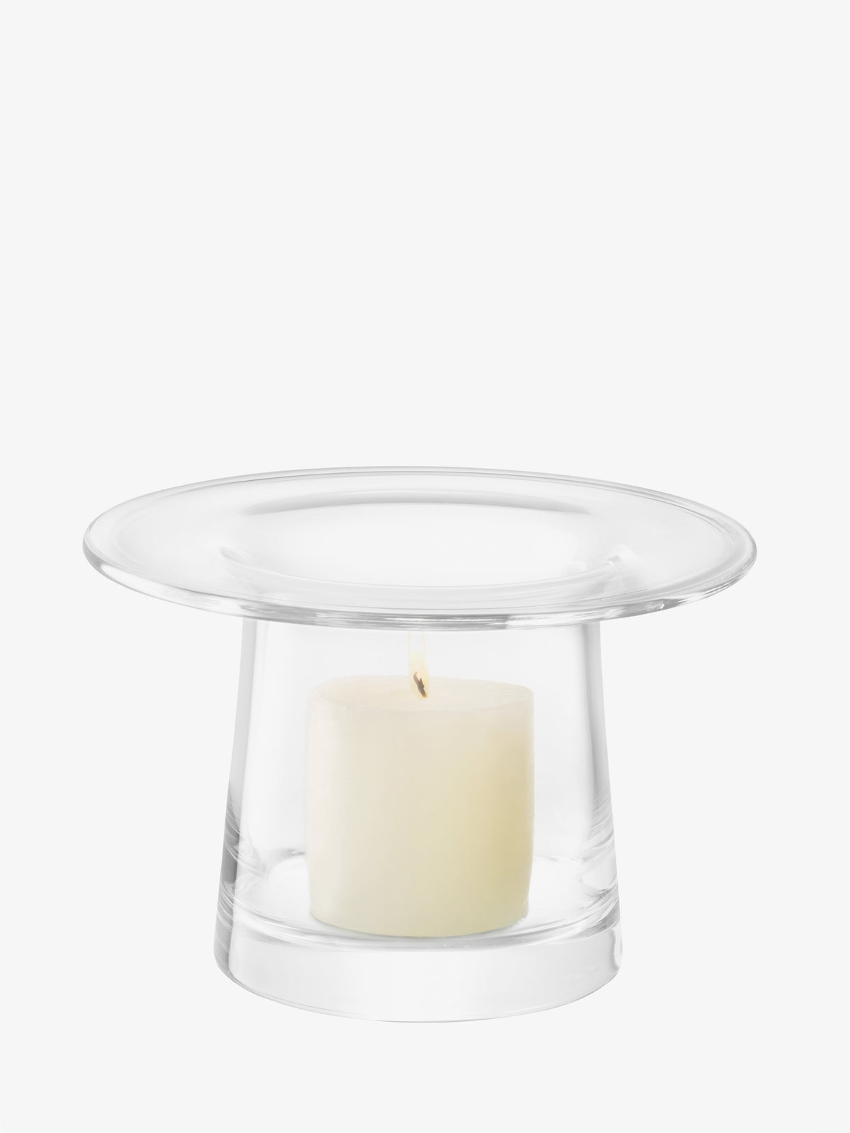 A contemporary mouth-blown LSA International Vase/Lantern with a wide, flat rim containing a lit pillar candle.
