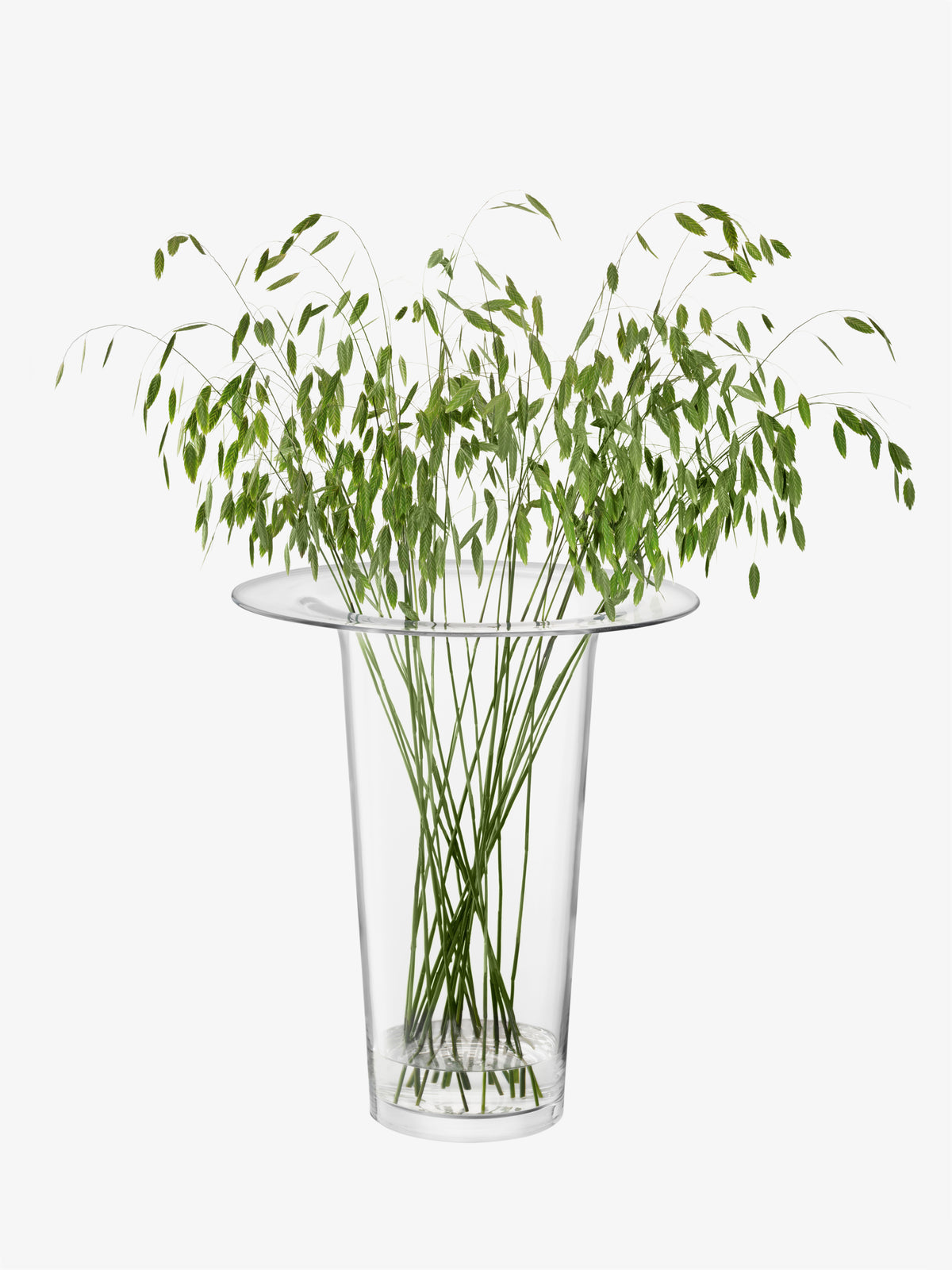Large mouth-blown LSA International Vase/Lantern containing tall green grasses as a statement flower arrangement.