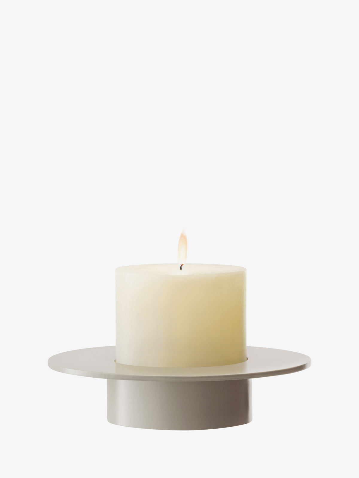 A lit pillar candle sits in an LSA-International Lantern/Vase, a wide, mouth-blown glass candle holder with a flat rim.
