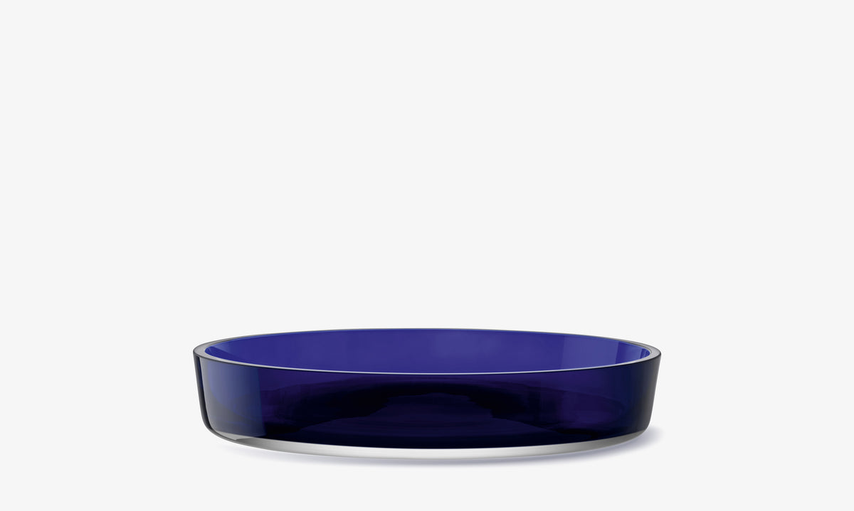 Wide, shallow LSA International Low Glass Bowl made of deep blue translucent glass.