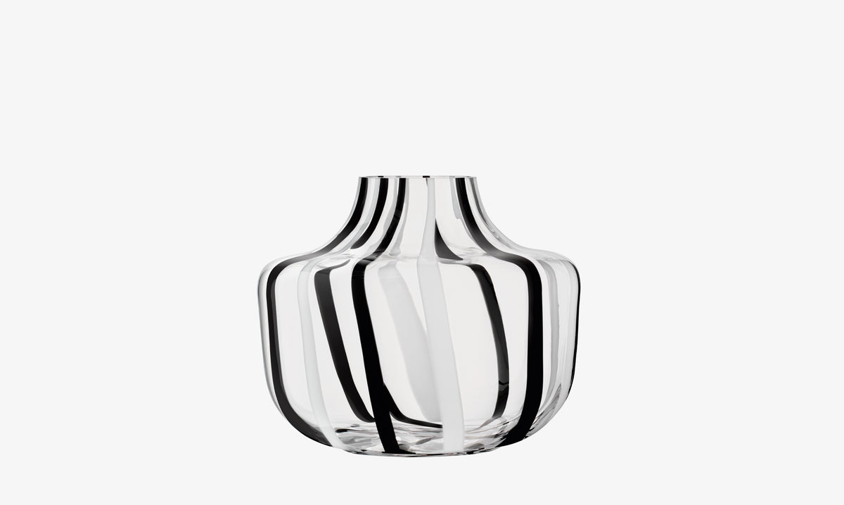 LSA International vase with a wide, rounded base, featuring vertical black and white opaque stripes in a modern, mouth-blown Op Art style.