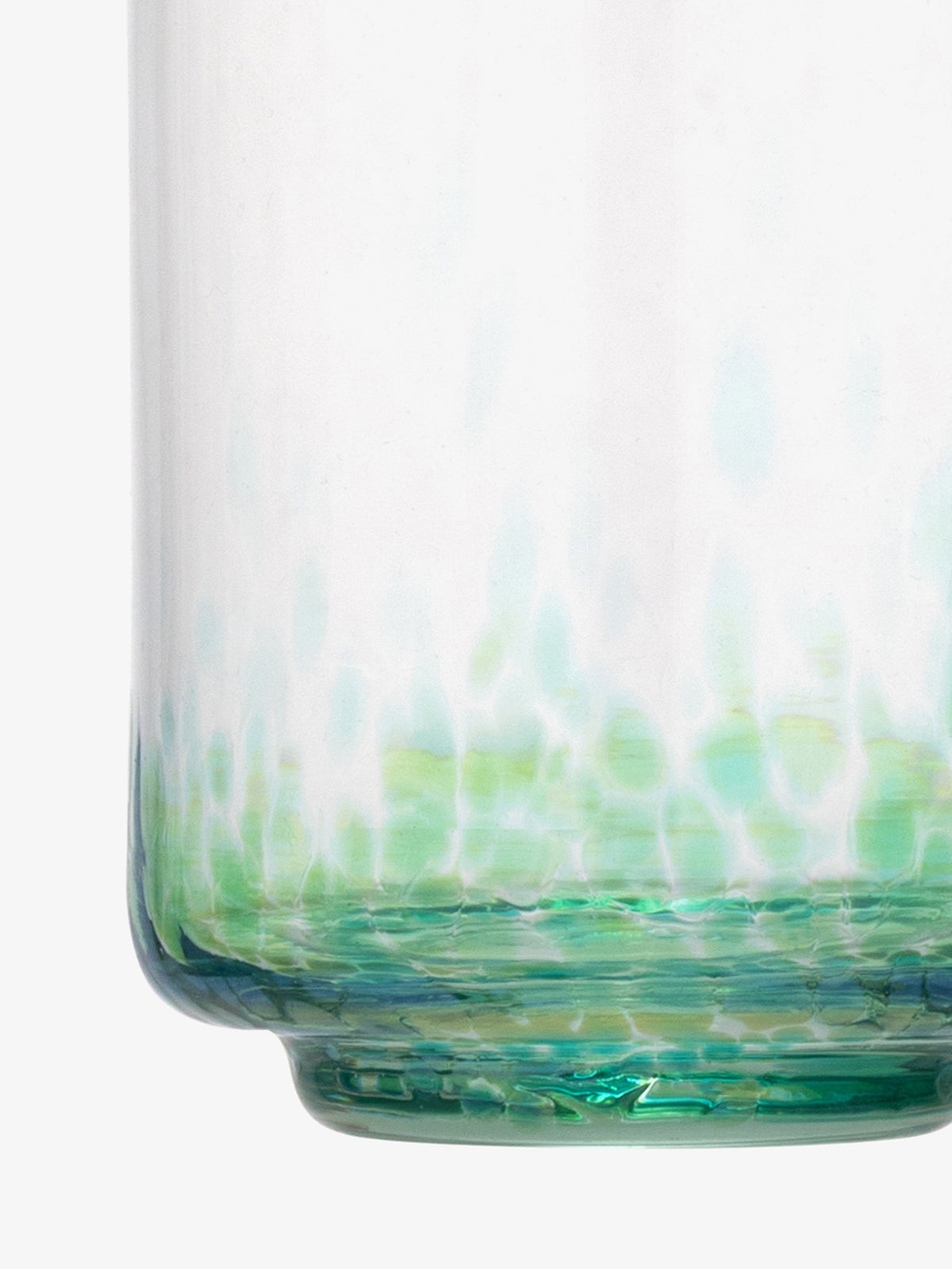 Close-up of the bottom part of the lsa-international Tumbler, crafted from transparent glass with green and blue tints, showcasing an abstract dappled pattern and a smooth surface reminiscent of recycled glassware.