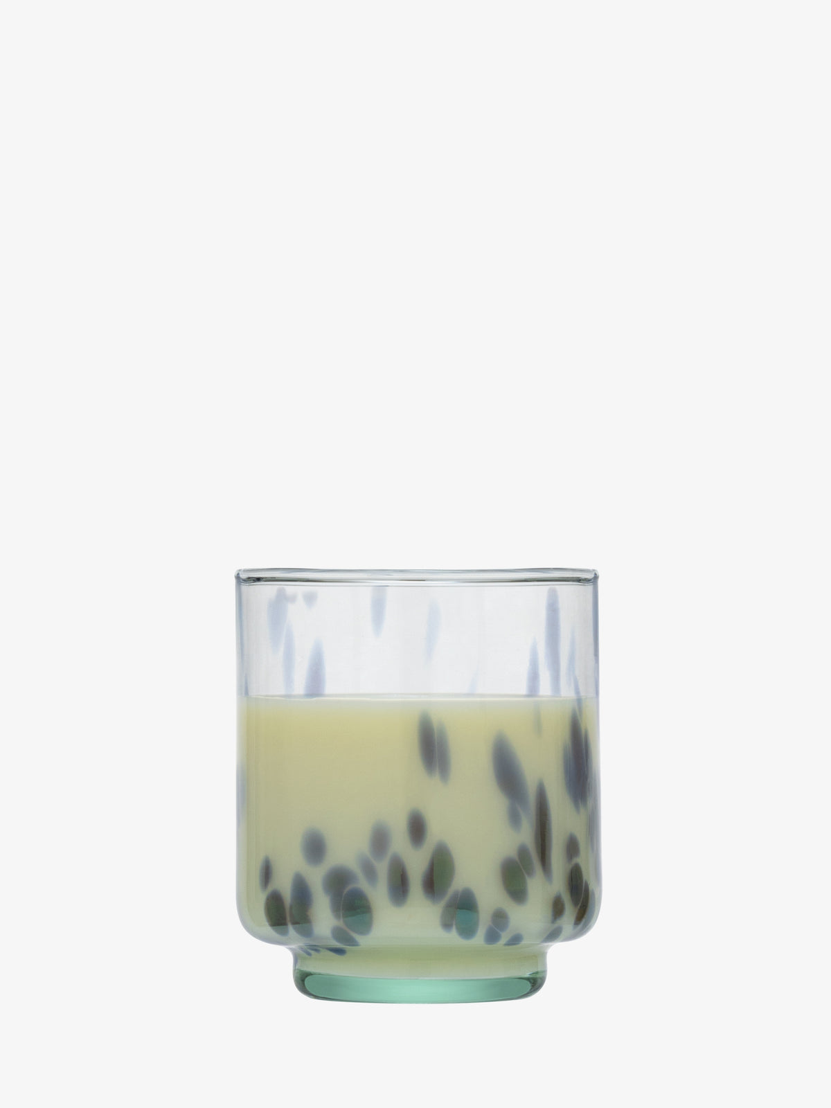 A clear speckled Tumbler by lsa-international holds a light yellow liquid with dark tapioca pearls settled at the bottom, resembling bubble tea, and is set against a plain white background.
