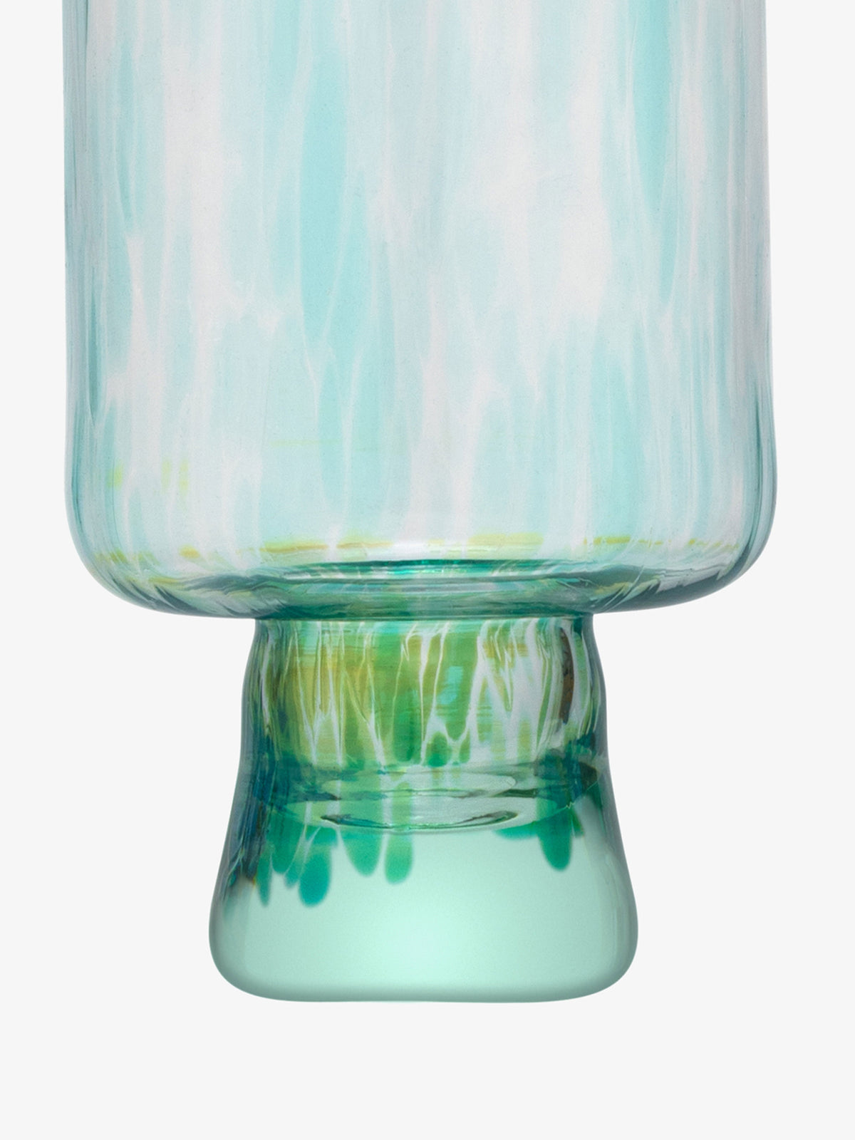 A close-up of the base of the lsa-international Wine Glass showcases its translucent body with a teal and green marbled pattern, a slightly flared foot, and subtle speckled details, reminiscent of artisanal recycled glassware.