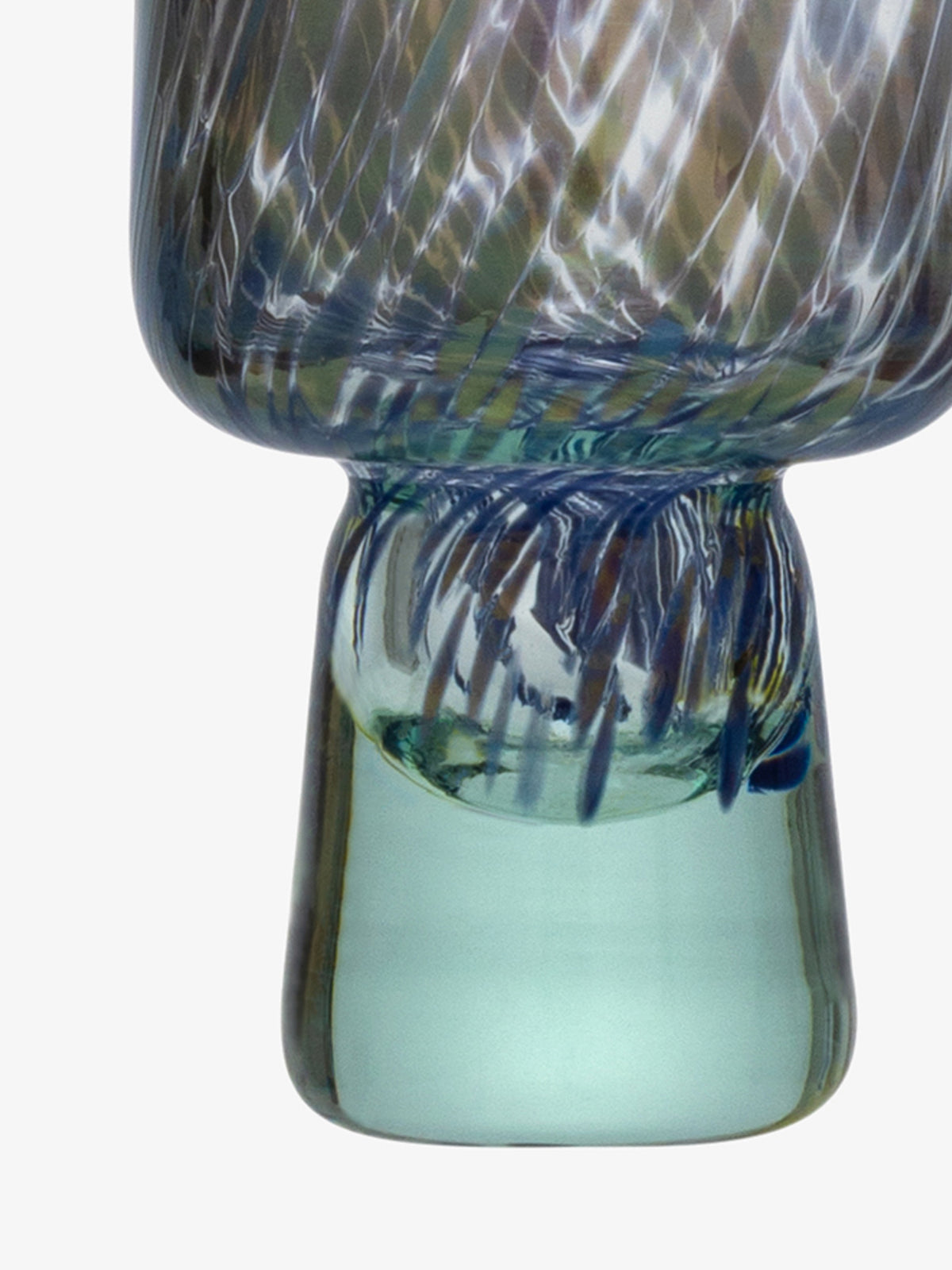 Close-up of the lower section of the Flute Glass by lsa-international, crafted from recycled glass and displaying swirling multicolored patterns with subtle speckling and a translucent greenish base, set against a plain white background.