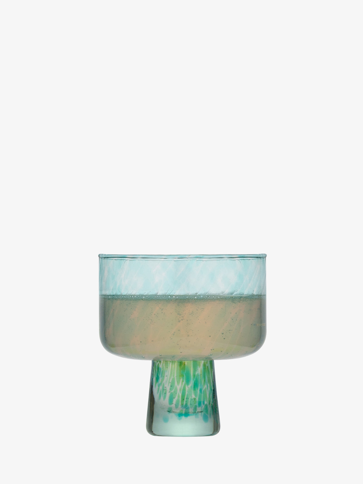A Cocktail Saucer by lsa-international, featuring a wide bowl and short stem with blue and green marbled patterns on a white backdrop—evoking sea glass decor. The bowl is shown filled with a light-colored liquid.