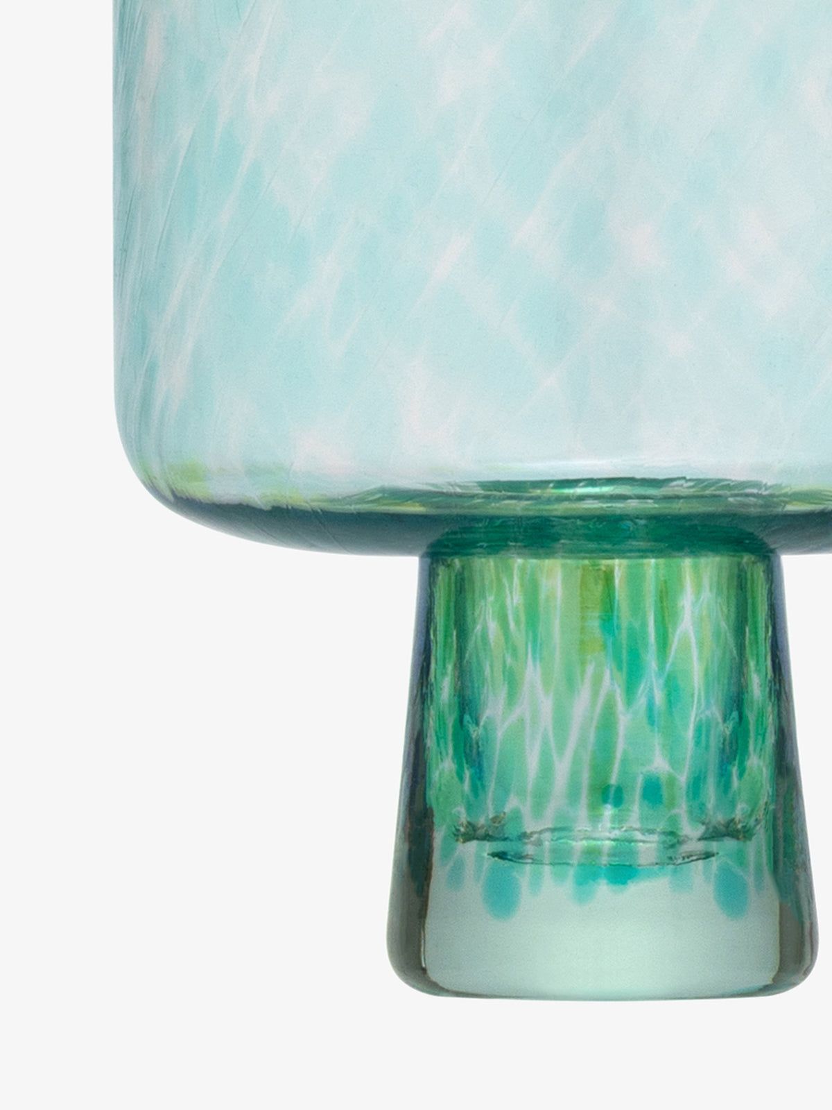 A close-up of the bottom part of the lsa-international Cocktail Saucer, featuring light blue and green glass with a textured, swirled pattern reminiscent of sea glass decor, set against a plain white background.