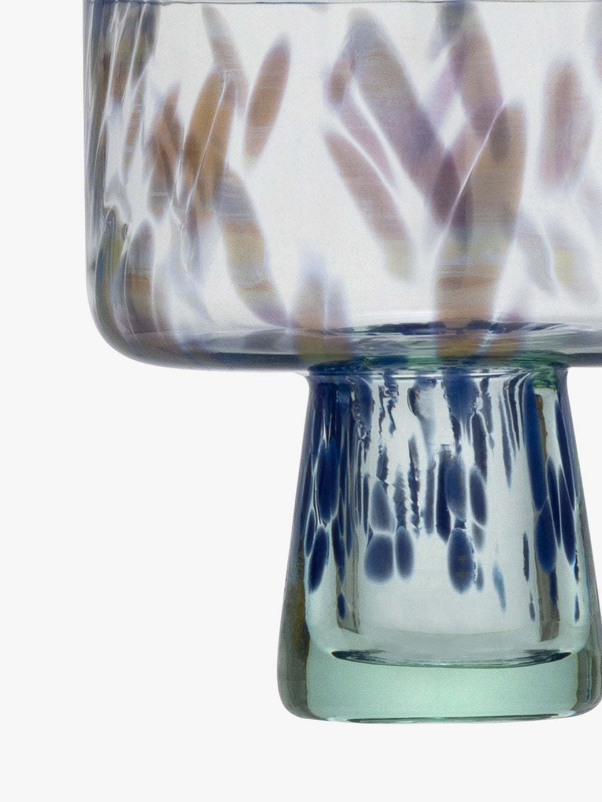 Close-up of the lsa-international Cocktail Saucer featuring a cylindrical base and swirling blue, purple, and beige patterns on a clear background, reminiscent of shimmering sea glass.