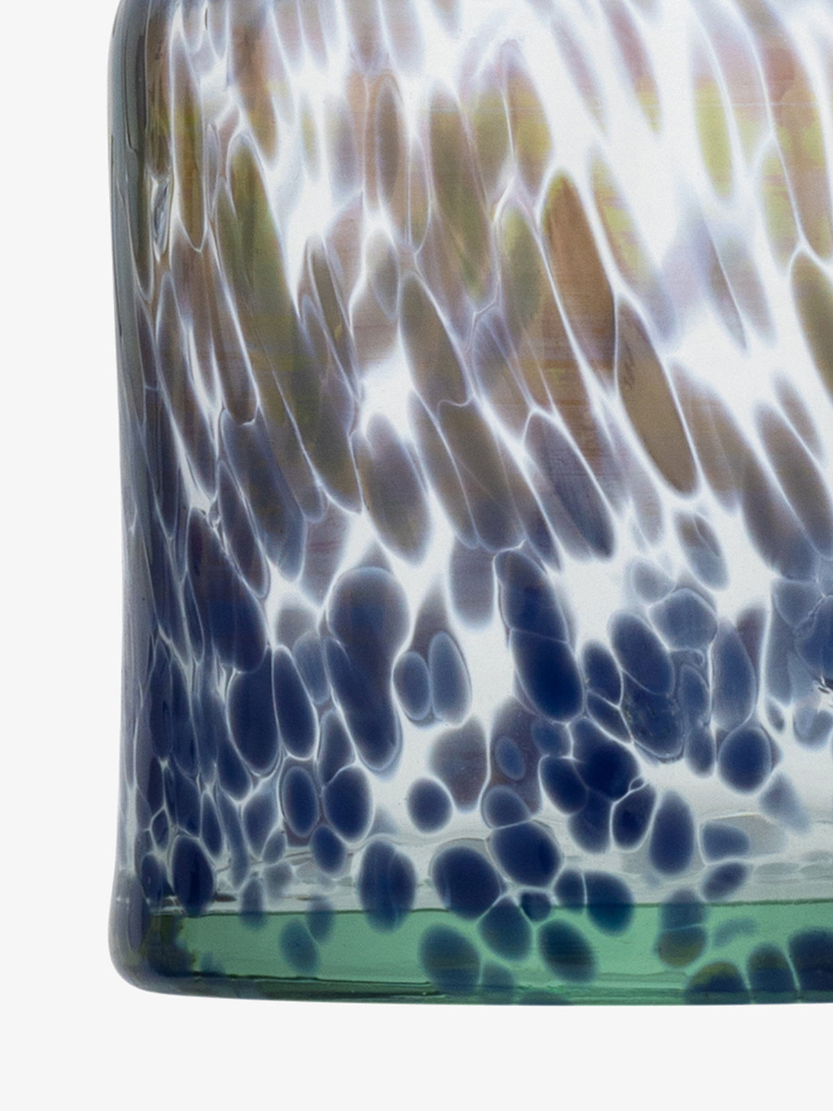 Close-up of the lsa-international Bud Vase, a mouth-blown glass piece with a spotted pattern in blue, brown, and white hues, featuring a slightly green-tinted base.