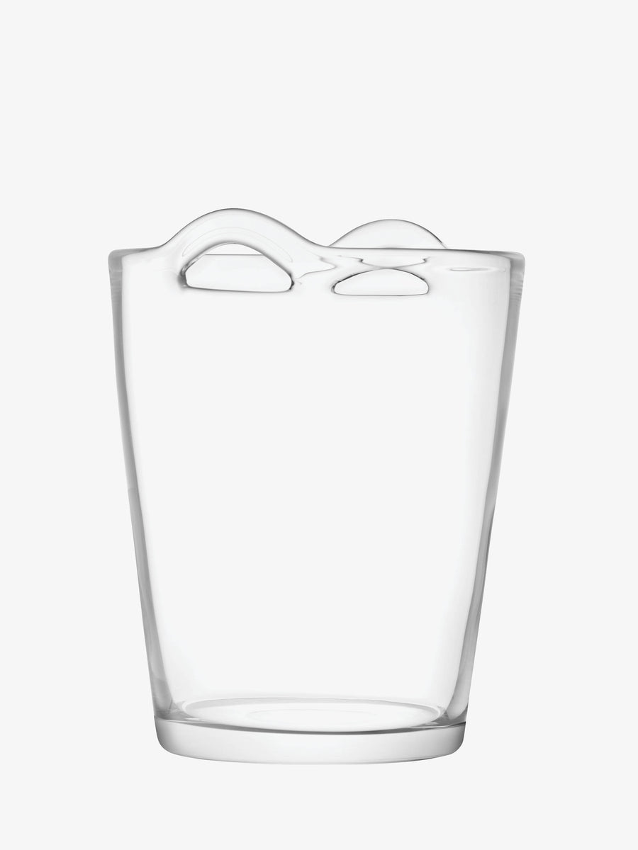 Lsa-international Champagne Bucket: A clear glass vase with an organic, flowing shape and an irregular, wavy rim. Mouth-blown for unique character, its top surface showcases two raised, curved edges that lend a modern, artistic style reminiscent of a handmade glass champagne bucket. Set against a plain white background.