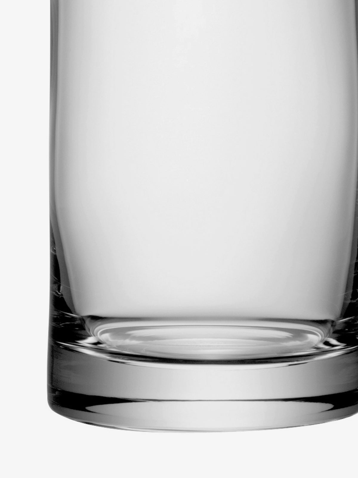 An LSA International Vase, mouth-blown from clear glass in a cylindrical shape with a thick, rounded base.