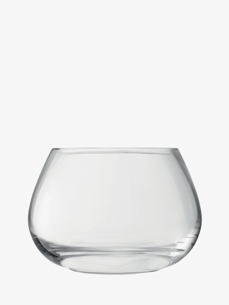 The lsa-international Table Arrangement Vase is a clear, round glass vase with a wide base and a slightly tapered opening, perfect as a centerpiece for your dining table. It is displayed here on a plain white background.