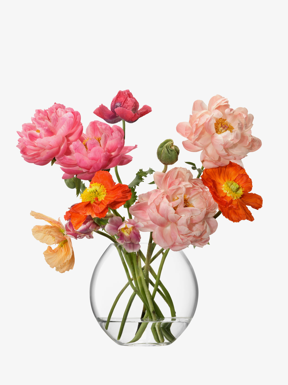 The lsa-international Bouquet Vase, crafted from clear mouth-blown glass, displays a vibrant arrangement of pink, peach, and orange flowers with green stems set against a white background.